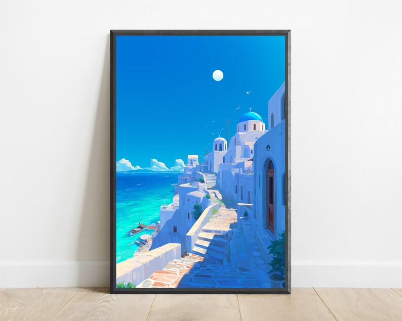 May include: A framed vertical art print depicting a coastal Mediterranean village with white buildings, blue domed roofs, and stone staircases leading toward a bright turquoise sea under a clear blue sky with a visible white moon in the daylight.