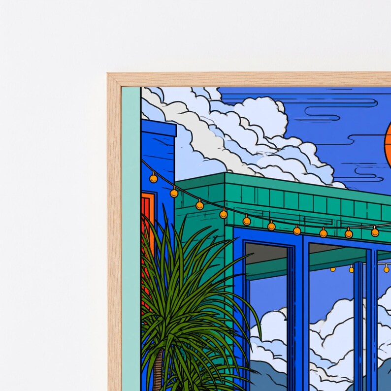 May include: A framed digital art print featuring a modern building with blue and teal walls, large glass windows, and a string of glowing yellow lights. A spiky green potted plant sits in the foreground under a bright blue sky with white clouds.