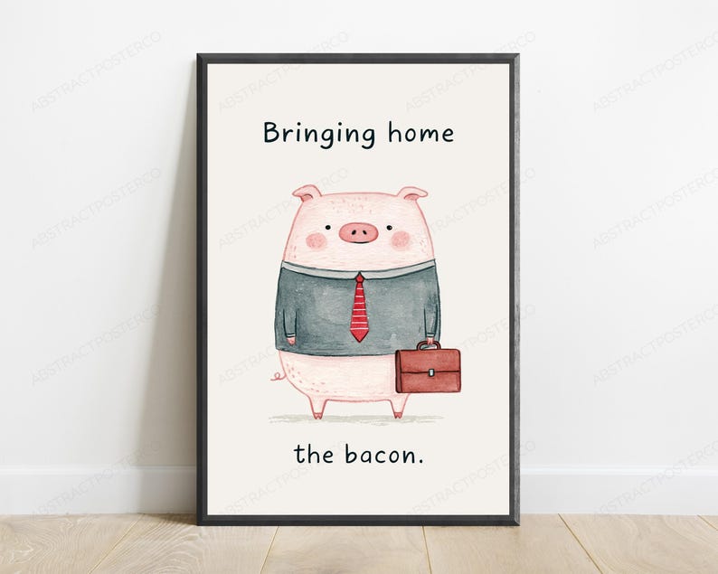 May include: A framed wall art print featuring a watercolor illustration of a pink pig dressed in a grey shirt and a red striped tie, holding a brown briefcase. The text above reads Bringing home and the text below reads the bacon.