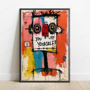 Pode incluir: Uma impressão de arte de parede retangular emoldurada apresentando um retrato abstrato estilizado com contornos pretos marcantes. A figura tem olhos circulares grandes, um nariz vermelho e o texto YOU YOURSELF! escrito em preto. O fundo utiliza pinceladas vibrantes de tinta laranja, rosa, amarela e azul.