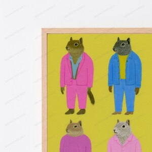 May include: A framed wall art print featuring four anthropomorphic squirrels on a mustard yellow background. The top left squirrel wears a pink suit and blue shirt, the top right wears a blue denim jacket and yellow shirt, and others wear pink.