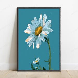 May include: A framed wall art print featuring a large, stylized daisy with light blue petals and a textured yellow center, set against a solid teal background. A smaller daisy bud appears at the bottom, connected by a green stem and leaves.