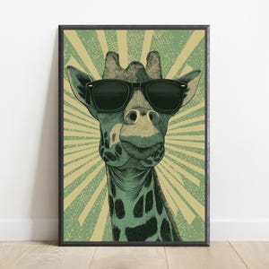 May include: A framed wall art print featuring a stylized illustration of a giraffe wearing black sunglasses. The giraffe is depicted in shades of green and black against a background of radiating light green and beige sunburst lines.