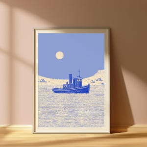 May include: A framed art print featuring a blue tugboat centered on a textured, light-colored sea. The background shows a pale, cream-colored shoreline with small buildings under a solid periwinkle blue sky with a round, pale moon.