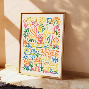 May include: A framed wall art print featuring a colorful, childlike line drawing of a family with two children, a house, a sun, a rainbow, and pets. The illustration uses vibrant orange, yellow, blue, green, and pink markers on a white background.