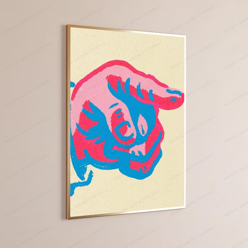 May include: A rectangular wall art print featuring a stylised graphic of a hand pointing downwards. The design uses a vibrant colour palette of bright pink, light pink, and electric blue against a textured, pale cream-coloured background.