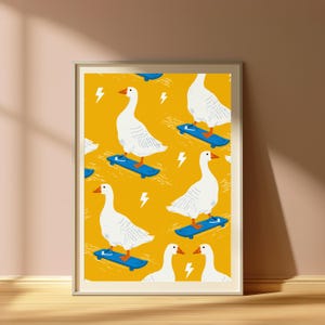 May include: A framed art print featuring a repeating pattern of white geese with orange beaks and feet riding blue skateboards on a mustard yellow background, interspersed with small white lightning bolt icons throughout the entire composition.