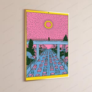 May include: A rectangular wall art print featuring a stylized illustration of a highway filled with cars under a bridge. The scene uses a palette of pink, blue, yellow, and green. A single figure stands on the bridge beneath a large yellow sun.