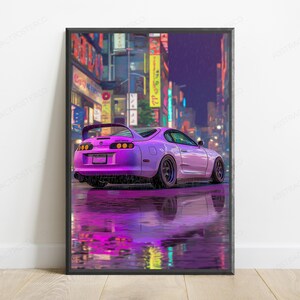 May include: A framed vertical poster featuring a purple sports car parked on a wet city street at night. The scene is illuminated by vibrant neon signs in the background, with the car's reflection clearly visible on the rain-slicked pavement.