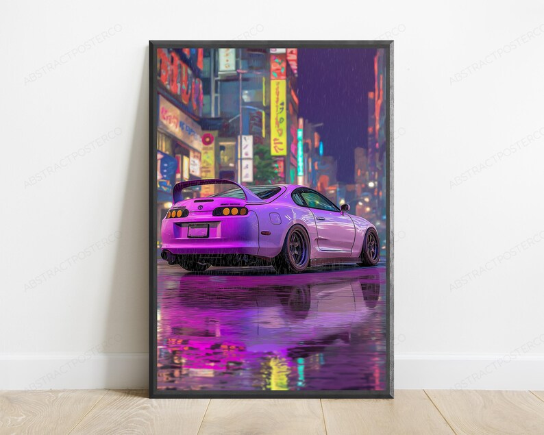 May include: A framed vertical poster featuring a purple sports car parked on a wet city street at night. The scene is illuminated by vibrant neon signs in the background, with the car's reflection clearly visible on the rain-slicked pavement.