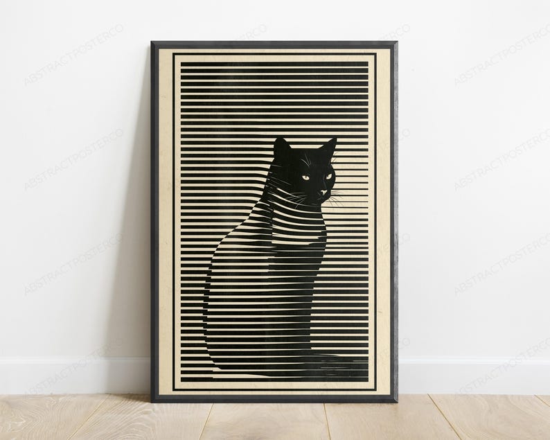 May include: A framed vertical wall art print featuring a black cat silhouette integrated into a pattern of horizontal black lines against a cream background. The cat is depicted in profile, facing right, with visible eyes and ears within the striped design.