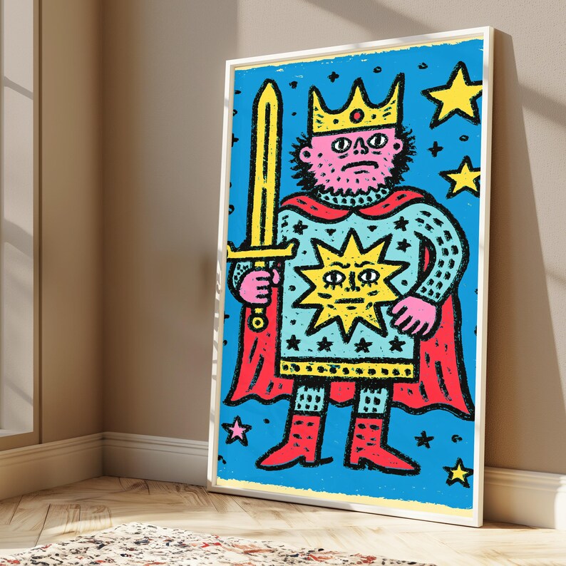 May include: A framed rectangular print featuring a stylized illustration of a king with a pink face, wearing a yellow crown and holding a yellow sword. The figure wears a light blue tunic with a large yellow sun emblem, a red cape, and red boots.