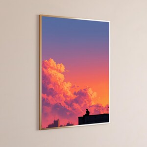 May include: A framed vertical wall art print featuring a silhouette of a person sitting on a rooftop against a vibrant sunset sky. The sky transitions from deep blue at the top to bright orange and pink hues near the clouds and city skyline.