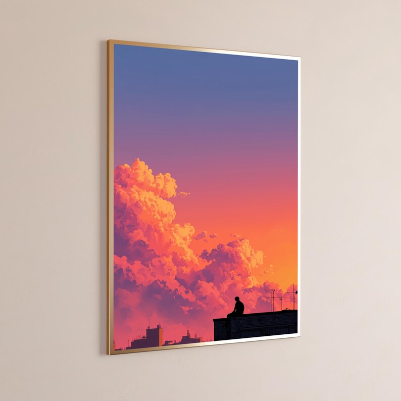 May include: A framed vertical wall art print featuring a silhouette of a person sitting on a rooftop against a vibrant sunset sky. The sky transitions from deep blue at the top to bright orange and pink hues near the clouds and city skyline.
