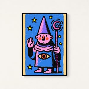 May include: A framed rectangular art print featuring a stylized illustration of a pink-skinned figure wearing a pointed hat and robe. The figure holds a staff with a crescent moon and has a large eye graphic on the chest, set against a blue background with yellow stars.