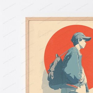 May include: A framed wall art print featuring a stylized illustration of a person wearing a baseball cap and a jacket with a backpack. The figure is positioned in profile against a large, solid red circle set on a light cream-colored background.