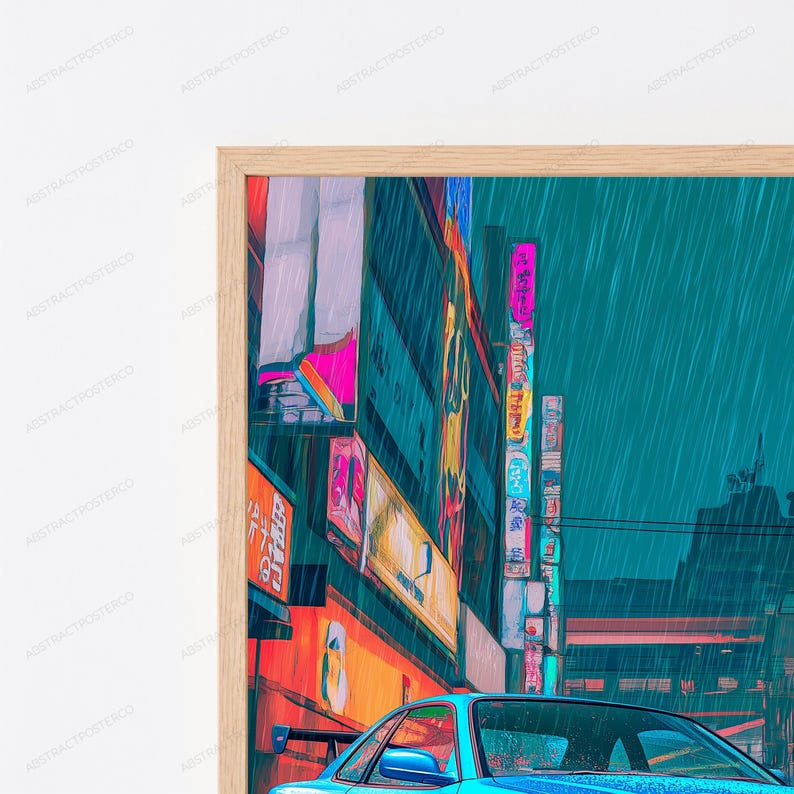 May include: A framed wall art print depicting a rainy city street scene at night with a blue sports car in the foreground. The image features vibrant neon signs with Japanese text, tall buildings, and a teal-toned sky, all encased in a light wood frame.