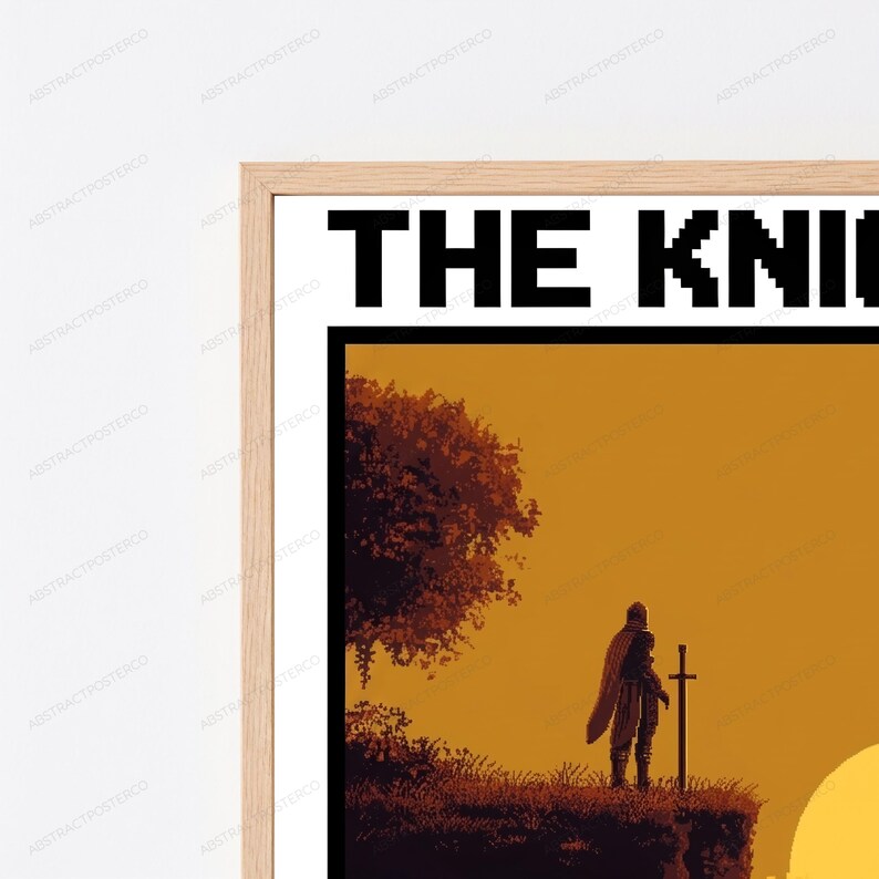 May include: A framed wall art print featuring a pixel art illustration of a knight standing on a cliffside with a sword at sunset. The text THE KNI is visible at the top in a black pixelated font. The frame is made of light-colored wood.