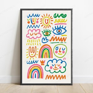 May include: A framed wall art print featuring a collection of colourful hand-drawn doodles on a cream background. The illustrations include a sun, rainbows, clouds with faces, eyes, and various wavy lines in vibrant shades of blue, pink, orange, and green.