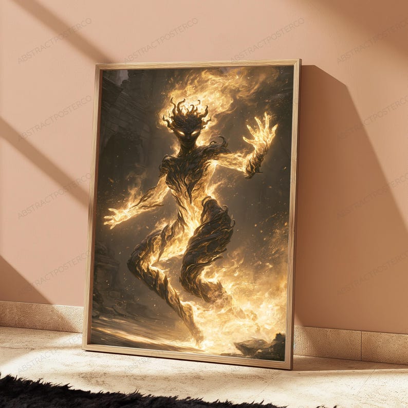 May include: A framed rectangular wall art print featuring a dark, humanoid figure composed of swirling golden flames and embers. The figure is depicted in a dynamic, floating pose against a dark, textured background with bright light.