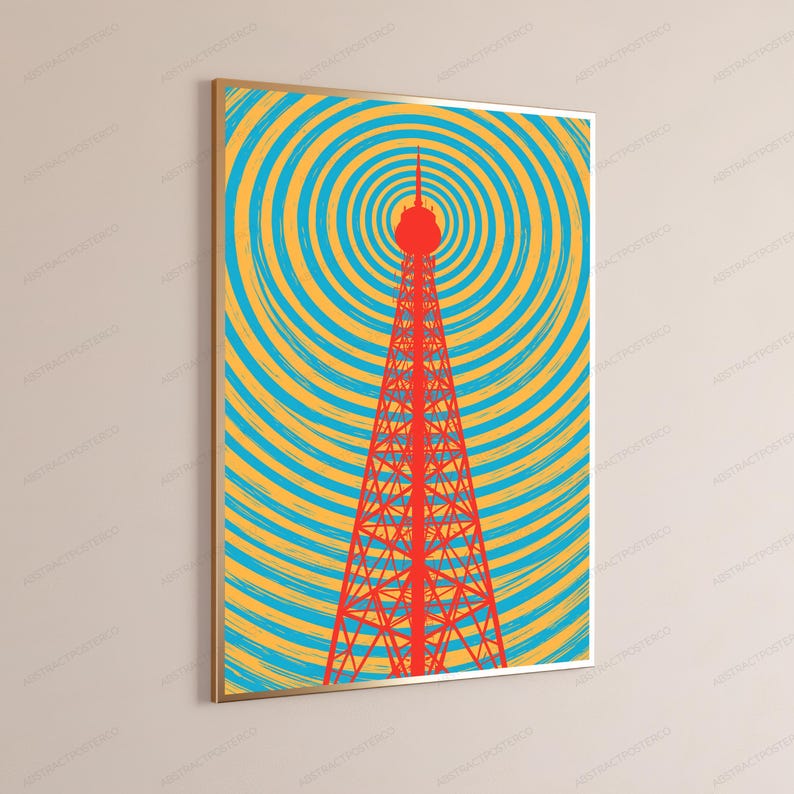 Puede incluir: Una impresi&oacute;n de arte mural rectangular en un marco dorado que presenta una torre de radio de celos&iacute;a roja centrada sobre un fondo de c&iacute;rculos conc&eacute;ntricos en tonos alternos de amarillo brillante y azul cian, creando un patr&oacute;n gr&aacute;fico vibrante.