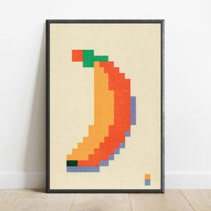 K&ouml;nnte beinhalten: Ein gerahmter Wandkunstdruck mit einer verpixelten Bananengrafik auf cremefarbenem Hintergrund. Die Banane besteht aus orangefarbenen, roten und hellblauen Pixelbl&ouml;cken mit einem gr&uuml;nen Stiel, einer dunkelgr&uuml;nen Basis und einem kleinen Farbschl&uuml;ssel.