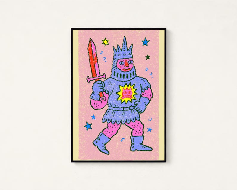 May include: A framed art print featuring a pink-skinned knight wearing blue armor and a crown, holding a red sword. The knight has a yellow sun emblem with a pink face on the chest. The background is textured pink with scattered blue and yellow stars.