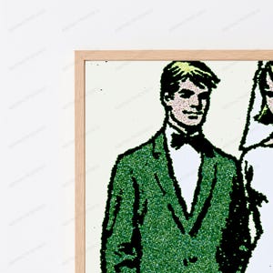 May include: A framed wall art print featuring a comic book style illustration of a person wearing a green suit jacket, a white shirt, and a black bow tie. The artwork uses a dot-matrix pattern for shading and is encased in a light wood frame.