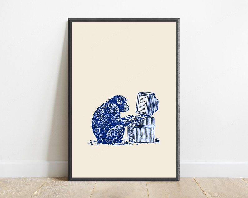 May include: A framed wall art print featuring a blue ink illustration of a chimpanzee sitting at a vintage computer desk and typing on a keyboard. The artwork is set against a solid cream-colored background, enclosed in a thin black frame.