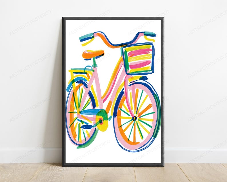 May include: A framed wall art print featuring a colorful, painterly illustration of a bicycle. The bicycle is rendered in vibrant strokes of pink, blue, yellow, orange, and green, complete with a front basket and a bright orange seat.