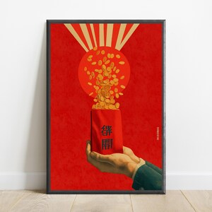 May include: A framed poster featuring a red background with a large orange circle and gold rays. A pair of hands holds a red envelope with black Chinese characters, from which a cascade of gold coins flows upward toward the orange circle.