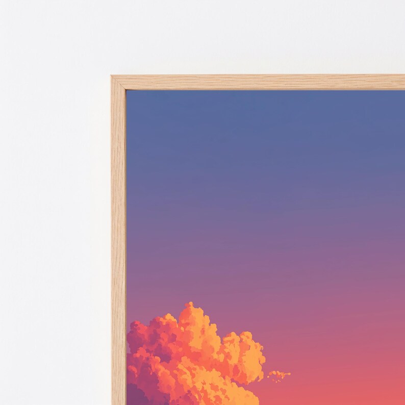 May include: A framed wall art print featuring a gradient sky transitioning from deep blue at the top to a vibrant orange and pink hue at the bottom, with a large, detailed cumulus cloud formation in bright orange and yellow tones at the base.