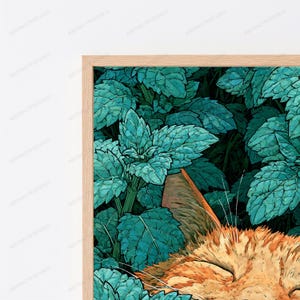 May include: A framed art print featuring a ginger cat resting among dense, vibrant teal and green foliage. The cat's orange fur is visible in the lower portion of the frame, contrasting with the cool-toned, detailed leaves that fill the background.