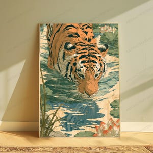 May include: A vertical wall art print featuring an orange and black tiger wading through shallow water. The scene includes green lily pads, tall reeds, and blooming lotus flowers in shades of white and pink, rendered in a stylized illustration.