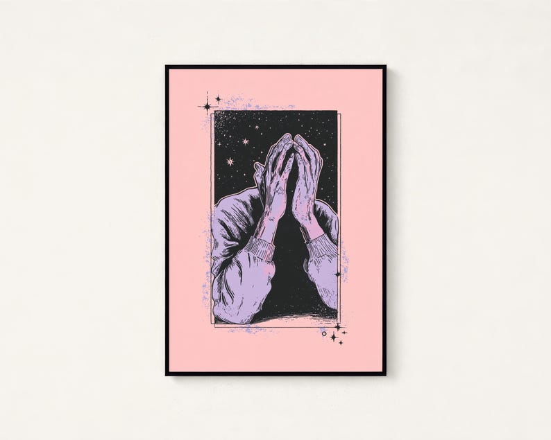 May include: A framed art print featuring a black and white illustration of a person with their hands covering their face. The figure is set against a dark, starry background within a rectangular border, all centered on a solid light pink background.