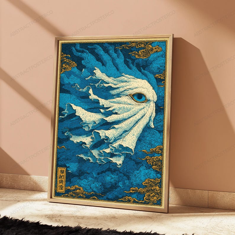 May include: A framed rectangular wall art print featuring a stylized white, flowing, ghost-like figure with a single prominent blue eye, set against a deep blue background of swirling clouds and gold accents, with vertical Japanese text in the corner.