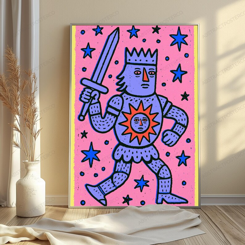 May include: A rectangular wall art print featuring a purple knight in armor with a crown, holding a sword, and wearing a chest plate with a sun emblem. The background is pink with scattered blue stars, all enclosed within a thin yellow border.