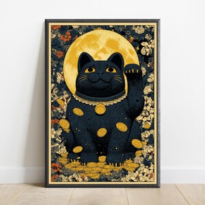 May include: A framed vertical art print featuring a black beckoning cat centered against a large yellow moon. The cat wears a gold collar with a bell, surrounded by floating gold coins and a dense background of dark blue and orange floral patterns.