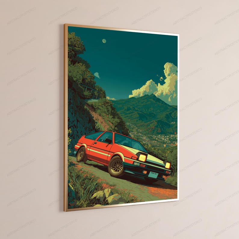 May include: A framed vertical wall art print featuring a red and white sports car driving on a winding mountain road. The scene includes a deep teal sky with a small moon, lush green hillsides, and a distant town nestled in the valley below.