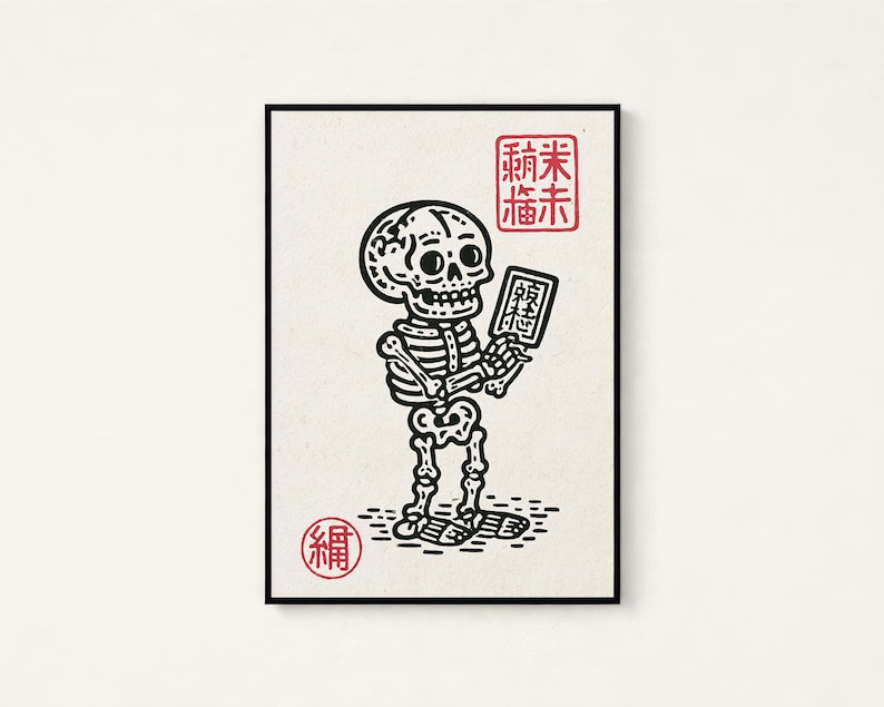 May include: A rectangular art print featuring a black line drawing of a skeleton holding a small rectangular object. The print includes red Japanese characters in a square stamp at the top right and a circular red stamp at the bottom left.