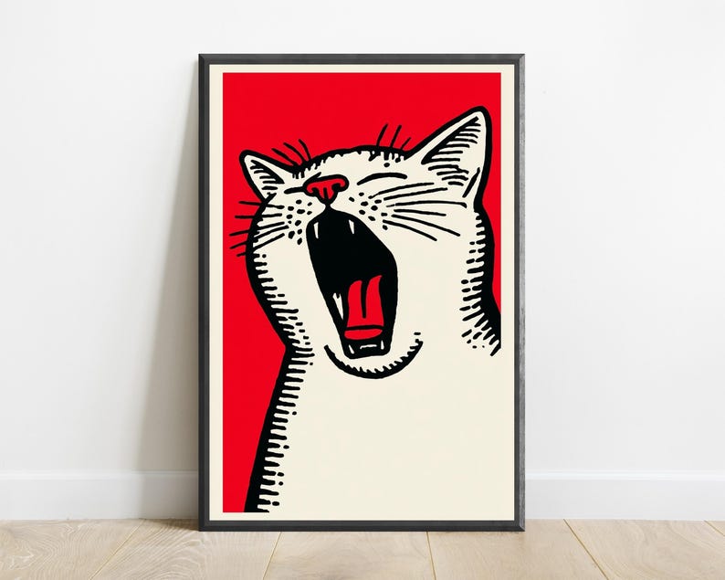 May include: A framed wall art print featuring a graphic illustration of a yawning white cat with black line details and a bright red background. The cat has its mouth wide open, showing a red tongue and dark interior, set against a solid red field.