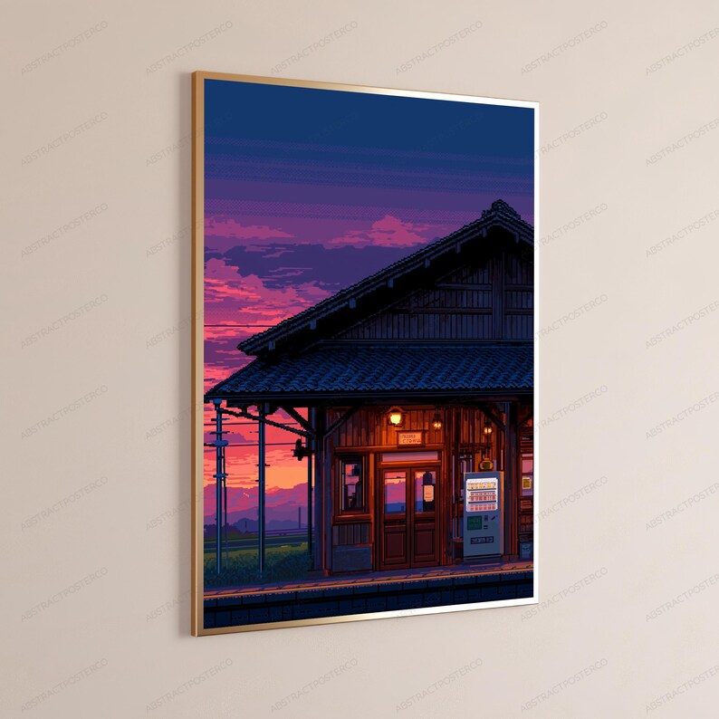 May include: A framed digital art print depicting a train station platform at dusk. The scene features a wooden building with a gabled roof, a glowing vending machine, and a vibrant purple and orange sunset sky over distant mountains.
