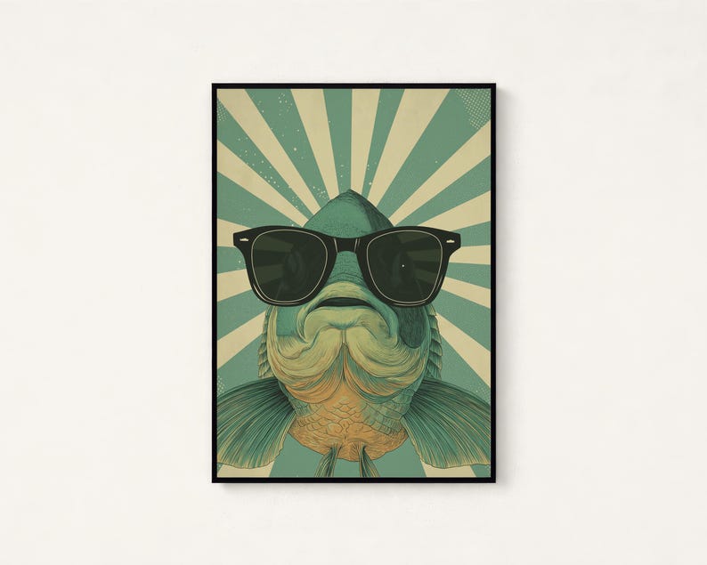 May include: A rectangular wall art print featuring a stylised illustration of a fish wearing large black sunglasses. The fish is centred against a background of alternating teal and cream-coloured sunburst rays, creating a graphic design.