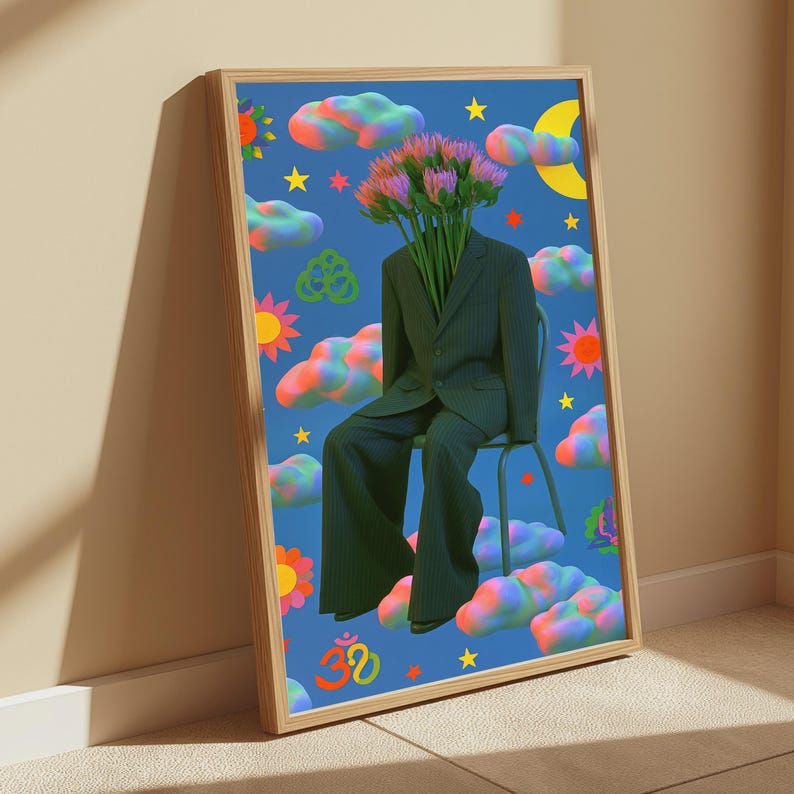 May include: A framed wall art print featuring a figure in a dark pinstripe suit sitting on a chair, with a bouquet of pink and green flowers replacing the head. The blue background is filled with colorful clouds, yellow stars, suns, and an Om symbol.
