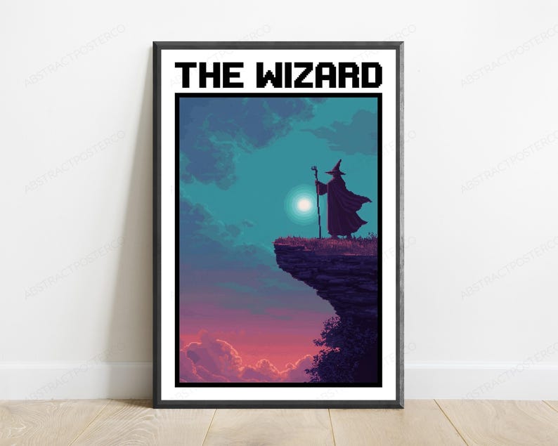 May include: A framed poster titled THE WIZARD featuring pixel art of a cloaked figure with a staff standing on a cliff edge. The scene depicts a dark purple and blue sky with a bright moon, transitioning to a pink and orange sunset at the horizon.