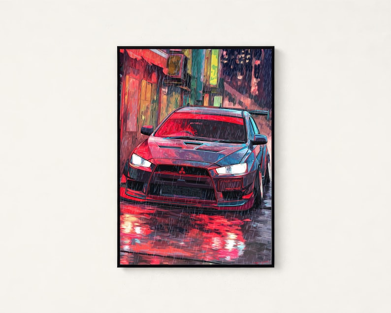 May include: A framed digital art print depicting a dark grey Mitsubishi Lancer Evolution saloon parked on a wet city street at night. The scene features vibrant red and orange light reflections on the rain-slicked ground and building walls.