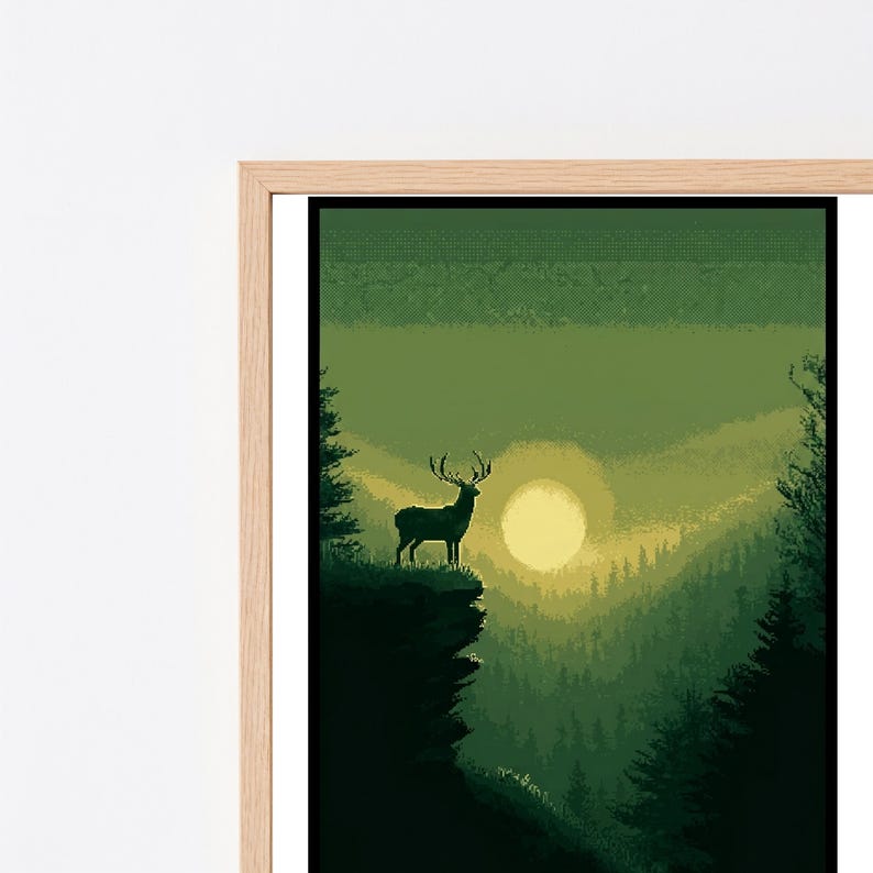 May include: A framed pixel art print featuring a silhouette of a stag standing on a cliff edge overlooking a dense forest valley. The scene is rendered in shades of green and yellow, with a large, pale sun glowing in the center of the horizon.