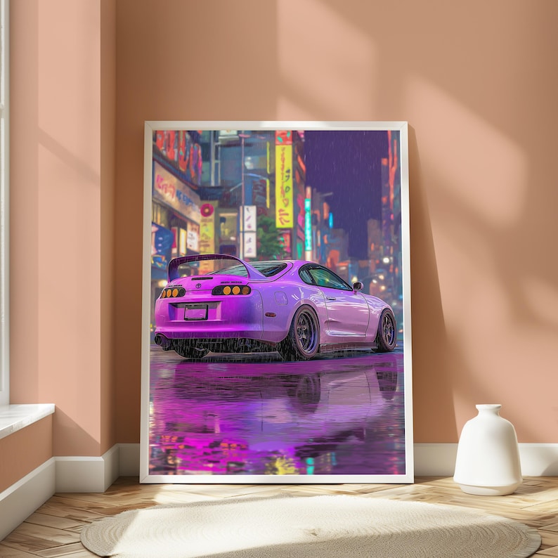 May include: A framed vertical art print depicting a purple sports car parked on a wet city street at night. The scene features vibrant neon signs in the background and a clear reflection of the vehicle on the rain-slicked pavement surface.