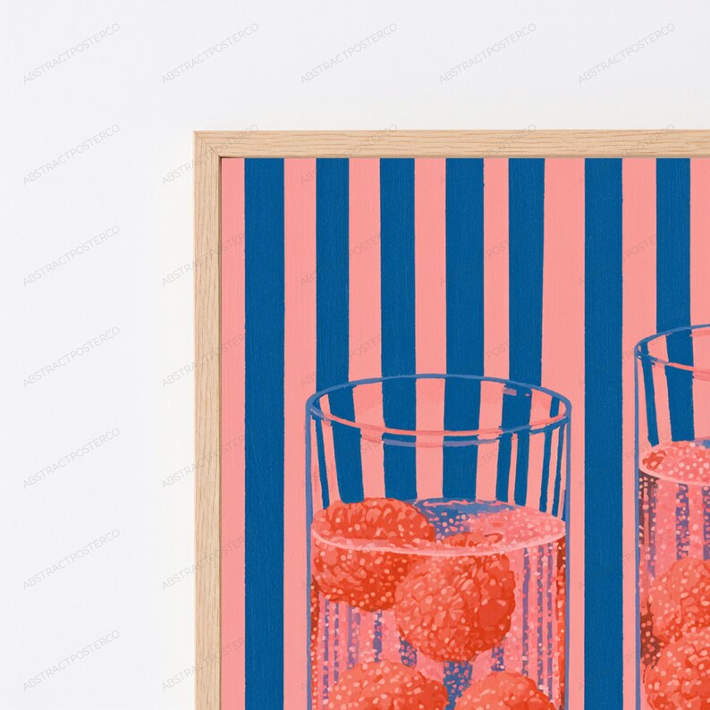 May include: A framed wall art print featuring a repeating pattern of vertical dark blue and light pink stripes. The foreground displays two clear drinking glasses filled with a pink liquid and several round, textured red raspberries.