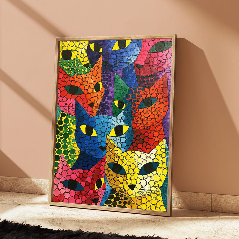 May include: A rectangular framed wall art print featuring a mosaic-style illustration of multiple cat faces in vibrant colors including yellow, blue, orange, green, pink, and purple. Each cat face is composed of small, distinct circular shapes.